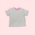 The Marley Edit pink, lemon, and cream striped cotton t-shirt with a pink neckline. Relaxed, boxy fit.