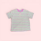 The Marley Edit pink, lemon, and cream striped cotton t-shirt with a pink neckline. Relaxed, boxy fit.