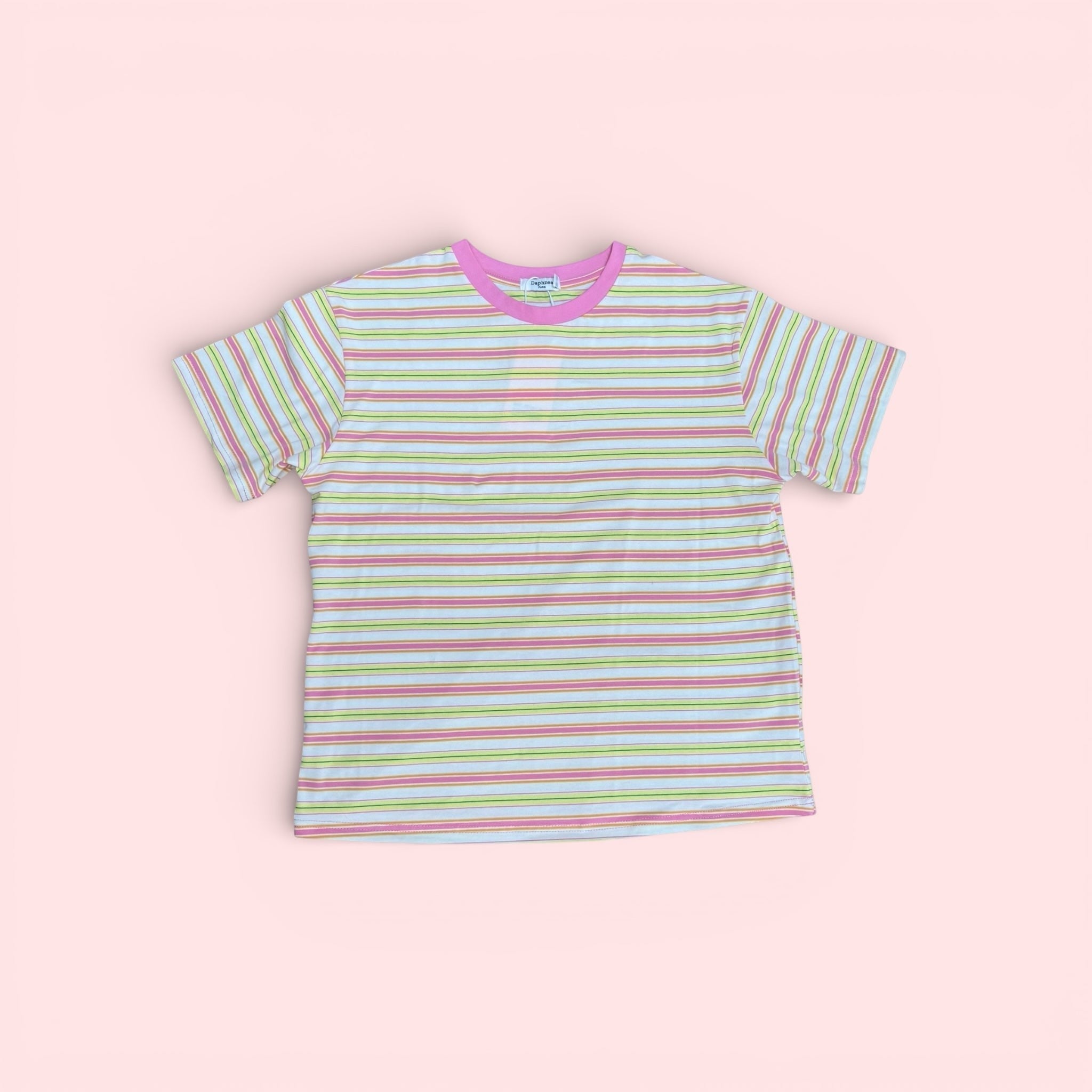 The Marley Edit pink, lemon, and cream striped cotton t-shirt with a pink neckline. Relaxed, boxy fit.